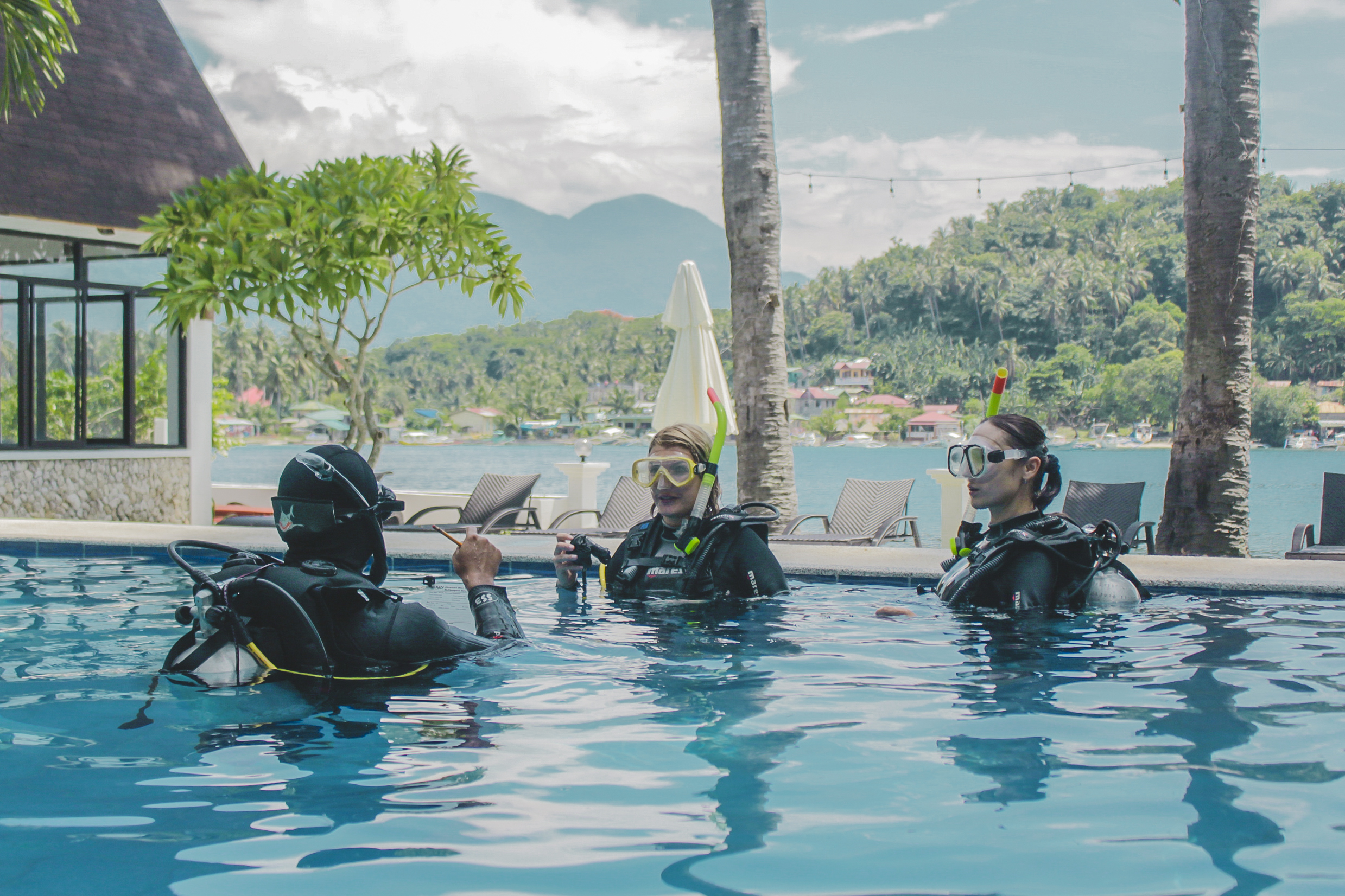 Teaching scuba diving to beginners in a training pool at Casalay Puerto Galera