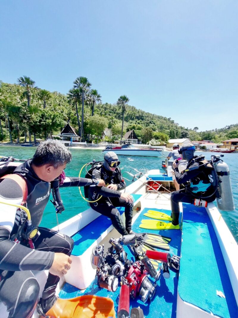 Scuba divers getting ready in front of Casalay resort in Puerto Galera
