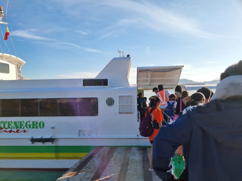 Passengers boarding a fastcraft from Batangas port to Balatero port Puerto Galera