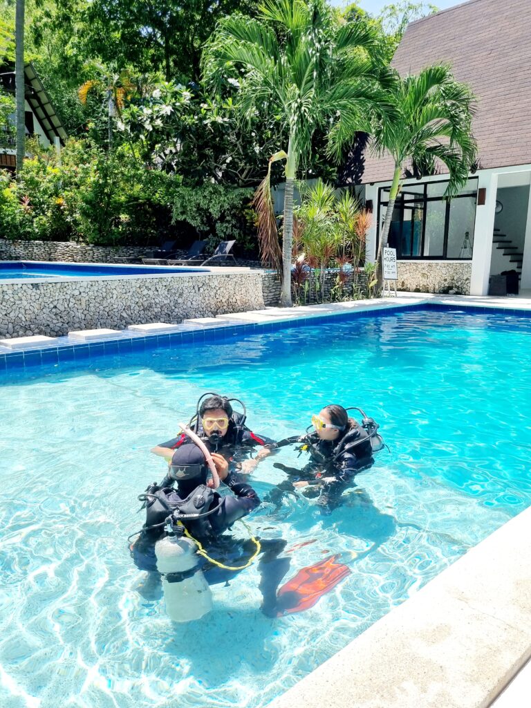 Scuba divers in training pool at Casalay Puerto Galera