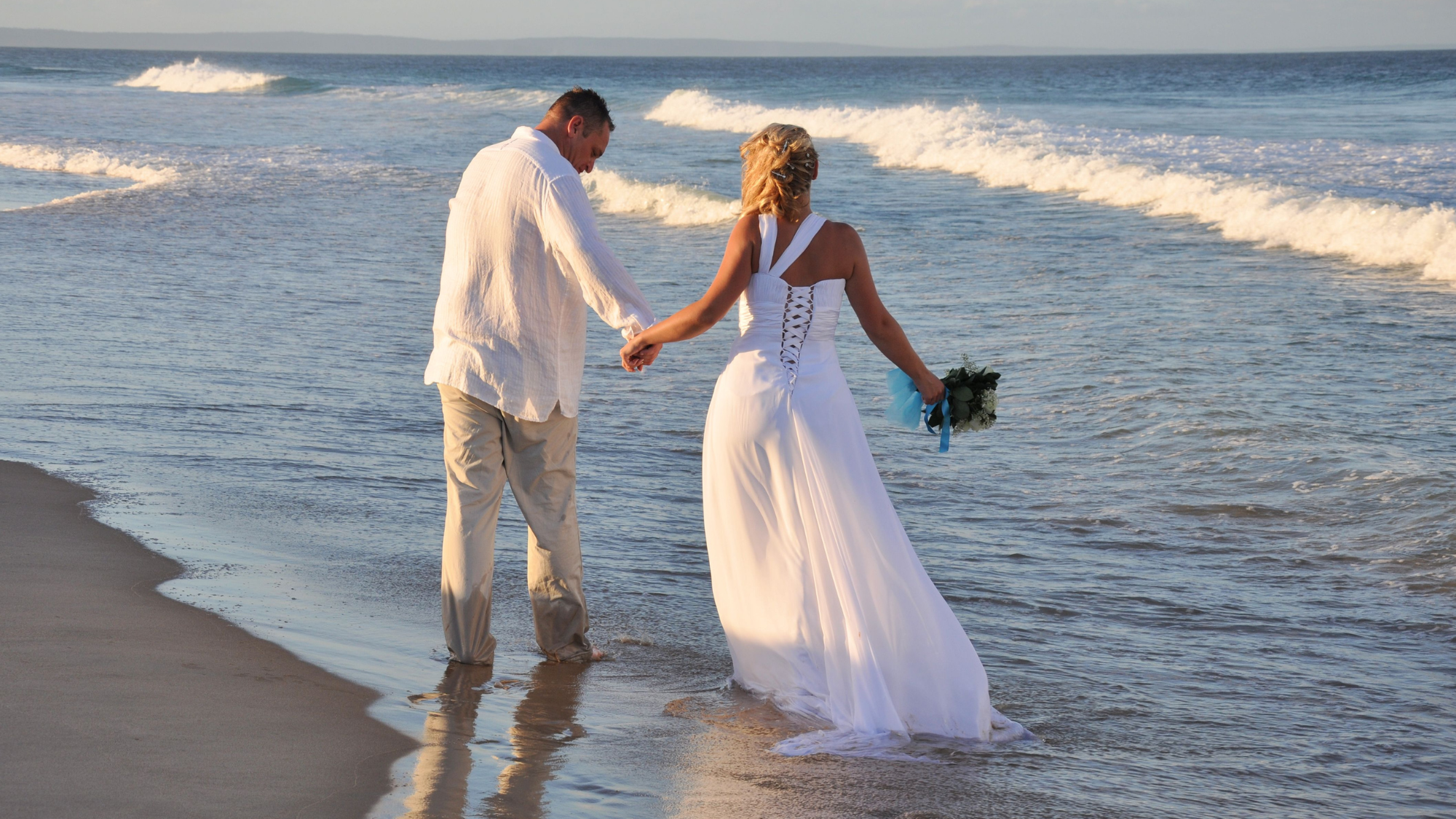 Bride and Groom on a beach after wedding