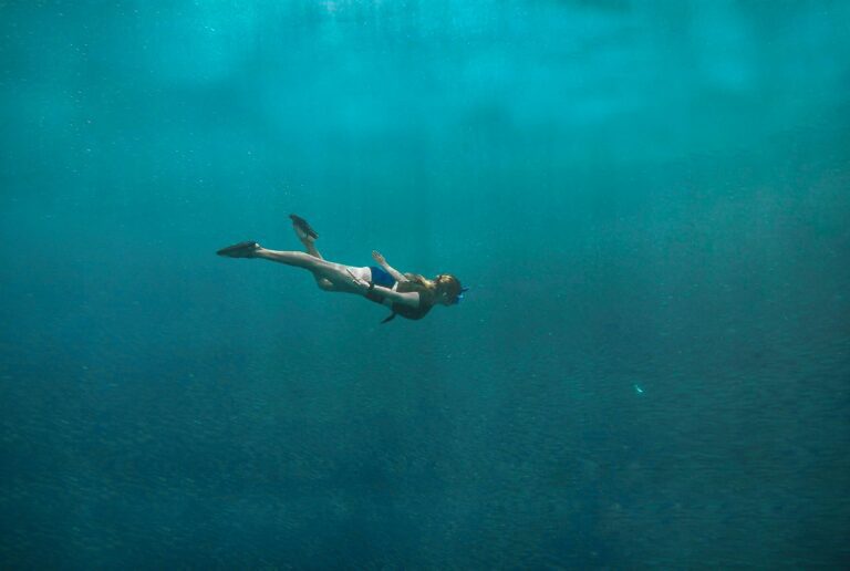 Photo of Woman Swimming Underwater