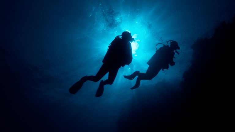 Scuba Divers maintaining proper buoyancy