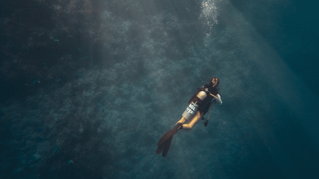 Scuba diver on sea floor