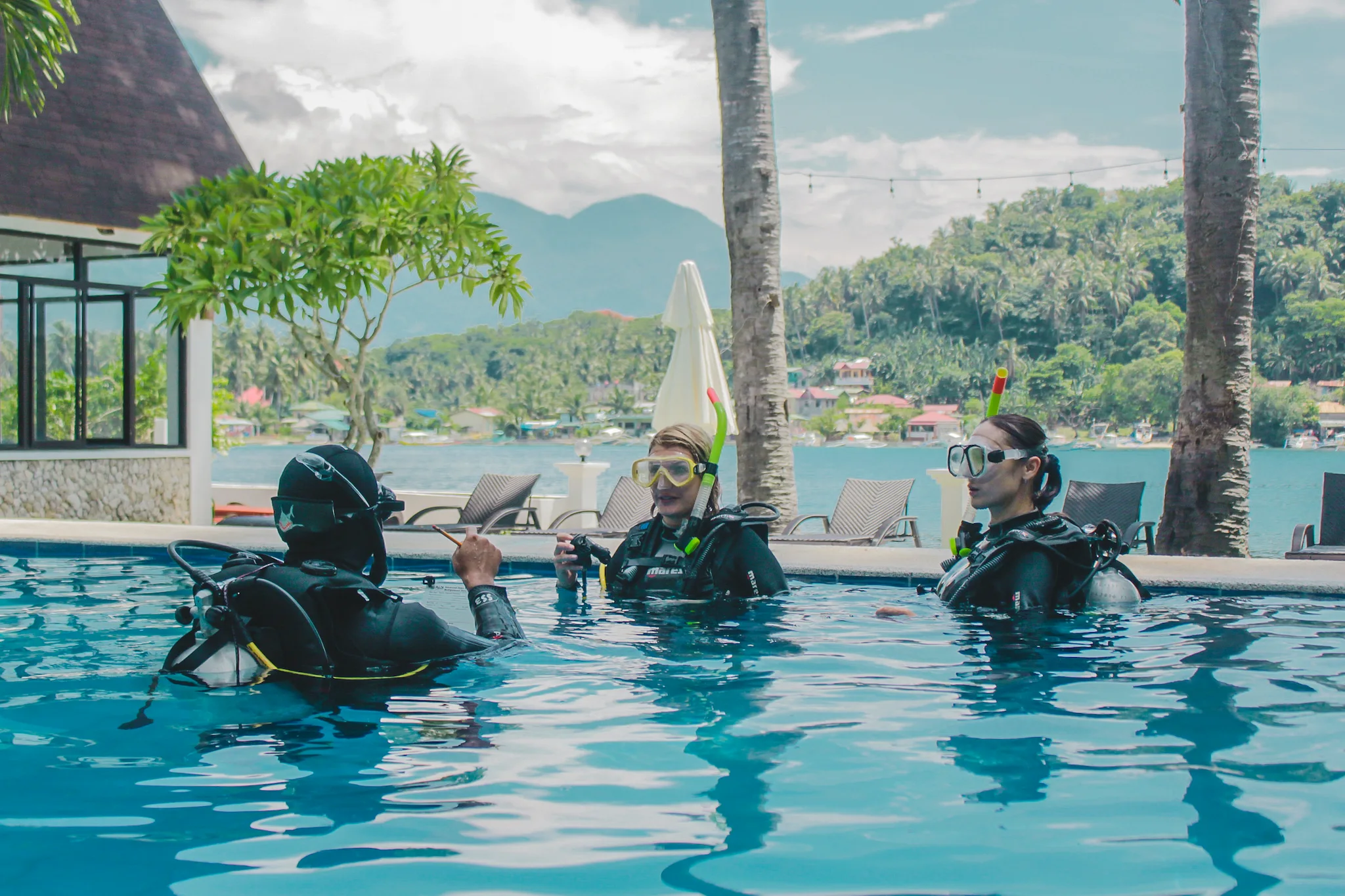 Teaching scuba diving to beginners in a training pool at Casalay Puerto Galera